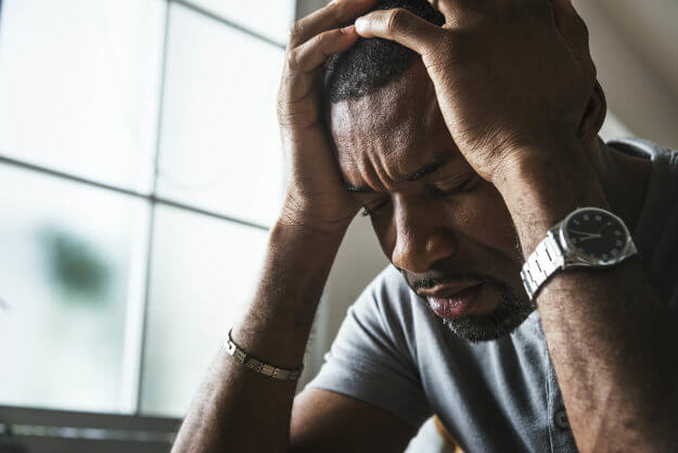 man thinking about alcohol withdrawal symptoms