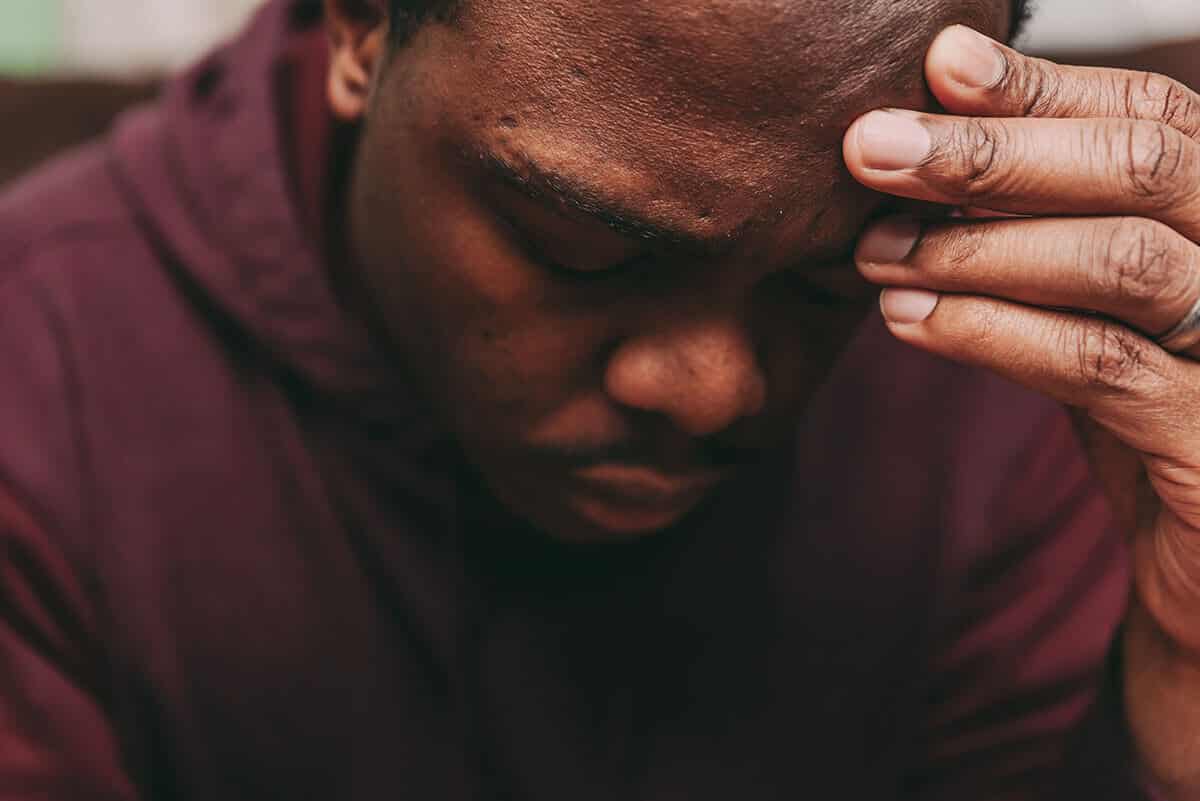 man thinking about psychological dependence